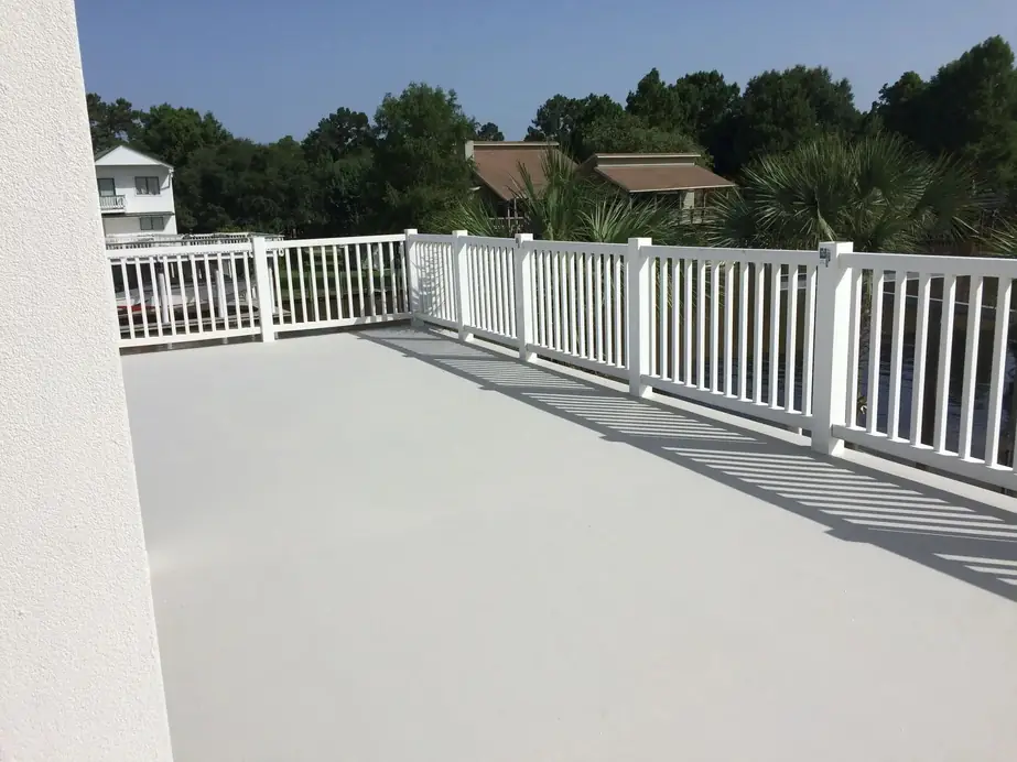 Grey coated deck with a white rail and its shadow lines